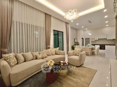 Luxurious open-plan living room with elegant decor and modern kitchen