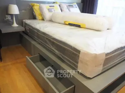 Modern bedroom with sleek storage bed and stylish decor