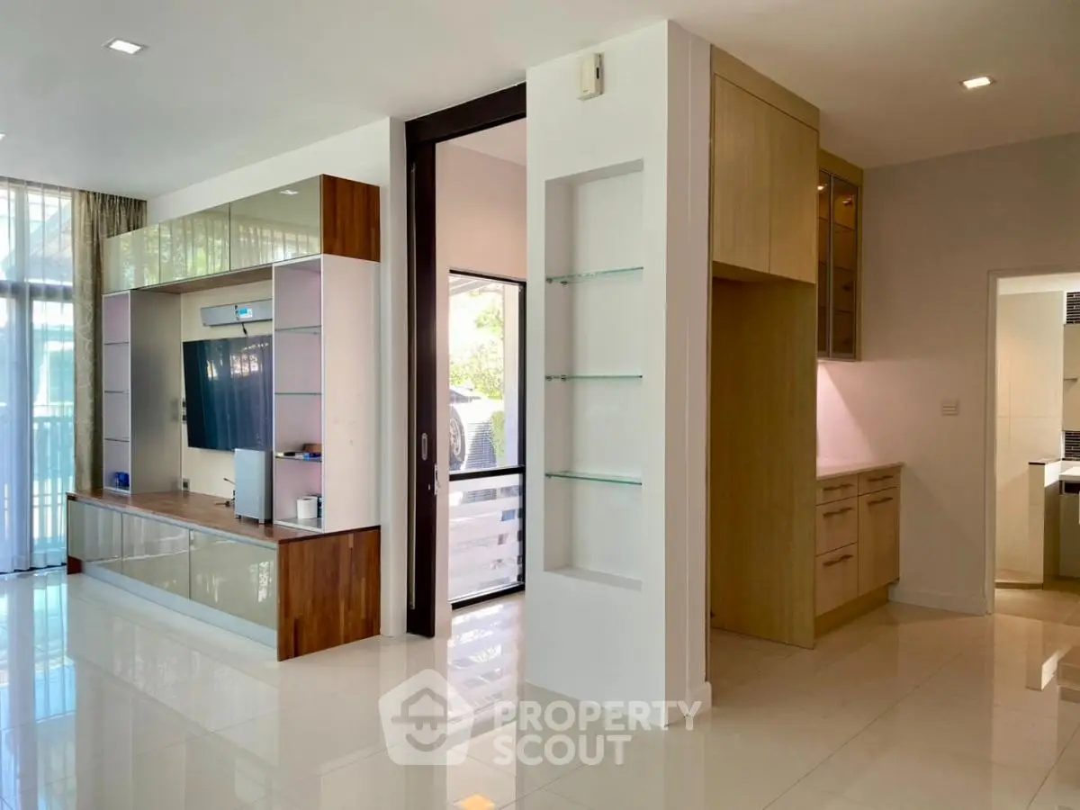 Modern living room with sleek entertainment center and open layout