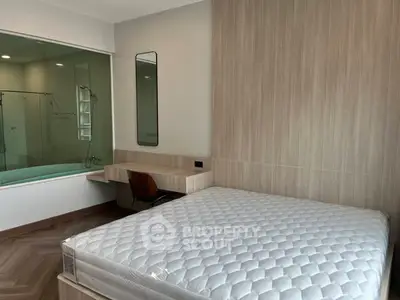 Modern bedroom with large window and stylish decor