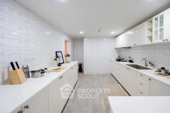 Modern kitchen with sleek white cabinetry and spacious countertops