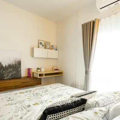 Cozy bedroom with stylish decor and natural light