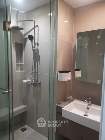 Modern bathroom with glass shower and sleek fixtures