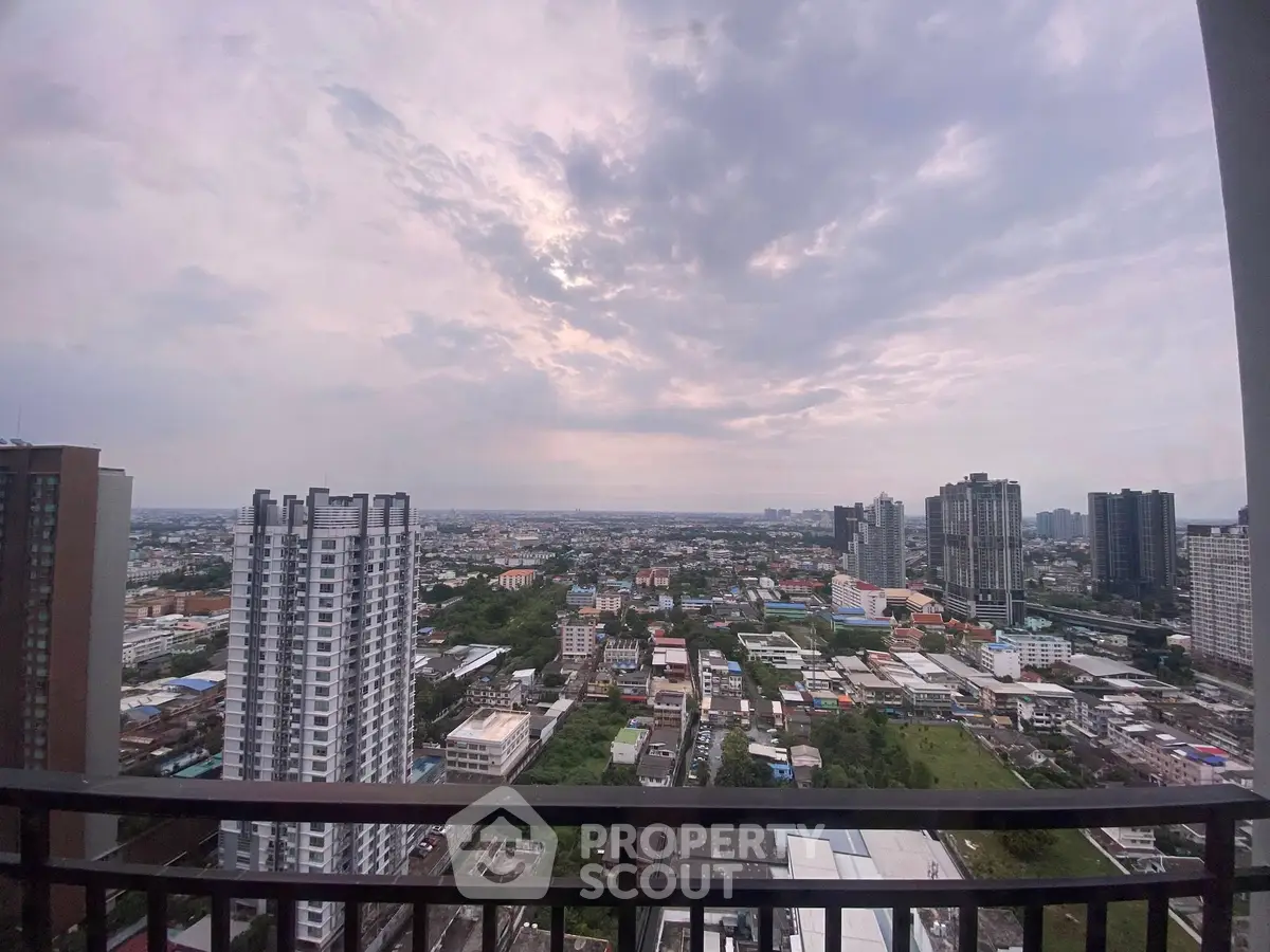 Stunning cityscape view from high-rise balcony with expansive skyline.