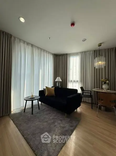 Modern living room with elegant decor and large windows