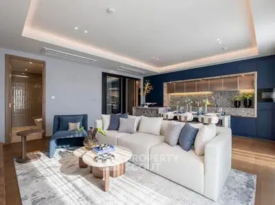 Luxurious open-plan living room with modern kitchen and elegant decor