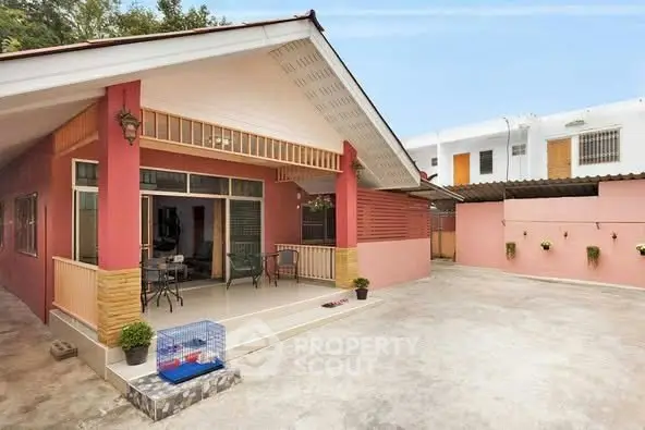 Charming single-story home with spacious patio and modern exterior design.