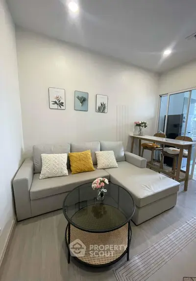 Modern living room with stylish decor and cozy seating area, perfect for relaxation and entertaining.