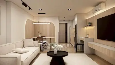 Modern living room with stylish furniture and open layout, featuring a cozy dining area and sleek design.