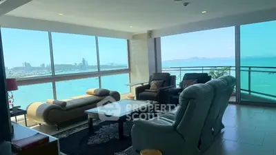 Luxurious living room with panoramic ocean views and elegant furnishings.