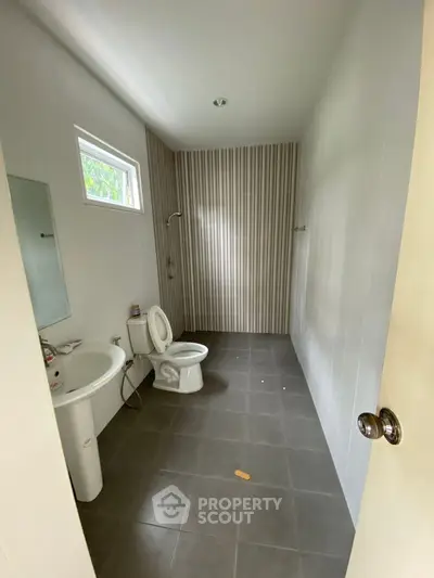 Spacious modern bathroom with sleek design and natural light