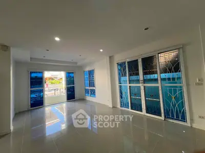 Spacious living room with large windows and modern design