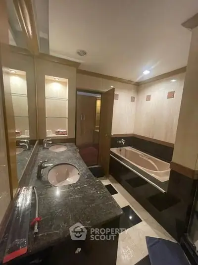 Luxurious bathroom with dual sinks and elegant marble countertops