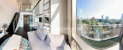 Stunning modern loft with panoramic city views and spacious balcony, featuring sleek interior design and abundant natural light.
