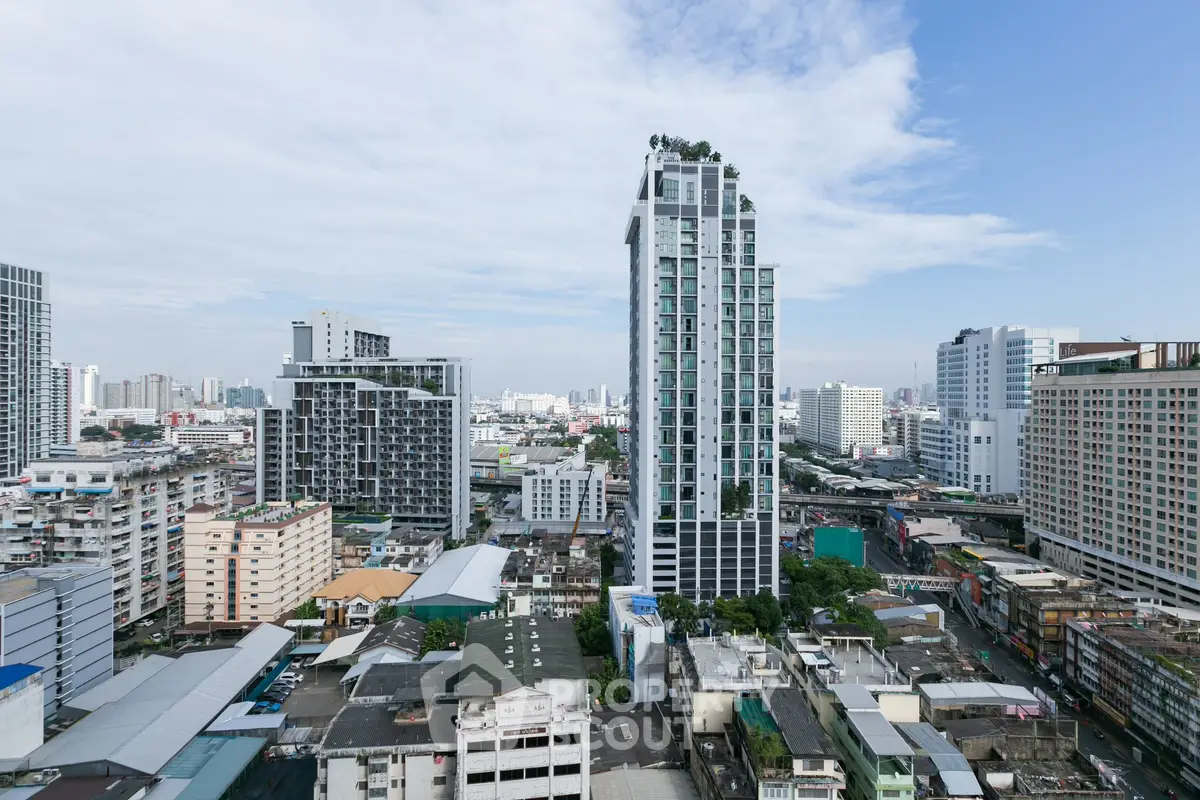 Stunning cityscape view featuring modern high-rise buildings under a clear blue sky.