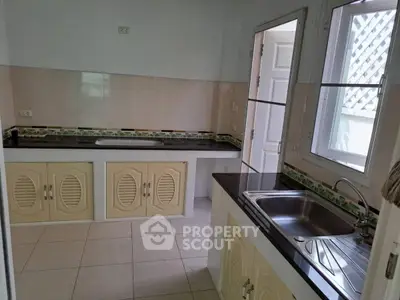 Charming kitchen with closed layout and ample counter space