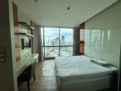 Modern bedroom with city view, featuring sleek design and large windows for natural light.