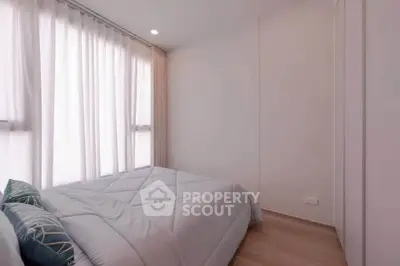 Cozy minimalist bedroom with soft lighting and modern decor