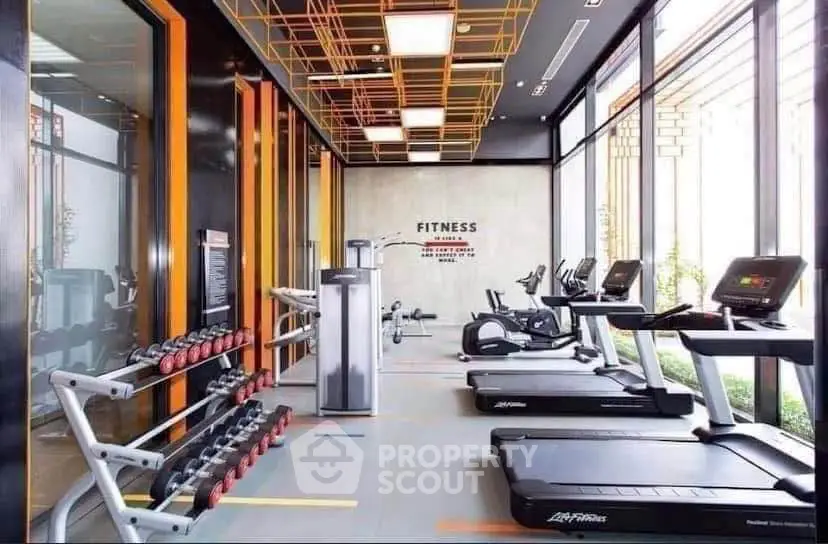 Modern gym with state-of-the-art equipment and stylish design, perfect for fitness enthusiasts.