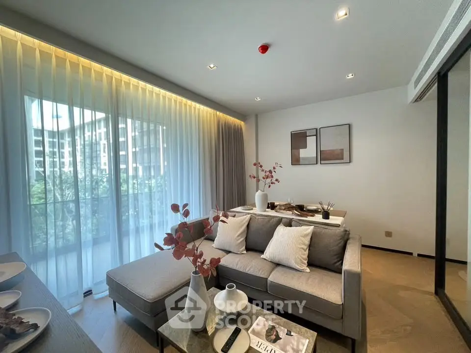 Modern living room with elegant decor and large window view