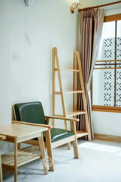 Stylish corner with modern wooden furniture and elegant curtains in a bright room.