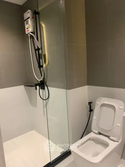 Modern bathroom with glass shower and sleek toilet design