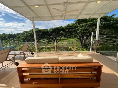 Stunning outdoor balcony with scenic view and modern seating area