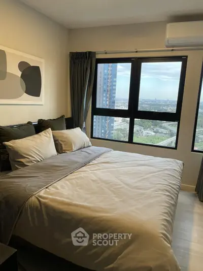 Modern bedroom with large window offering stunning city view, featuring stylish decor and air conditioning.