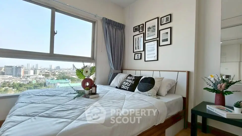 Chic bedroom with city view, stylish decor, and cozy ambiance in modern apartment.