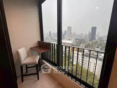 Chic balcony with city skyline view, perfect for relaxation or work-from-home setup.