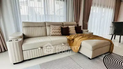 Luxurious living room with elegant beige sofa and stylish decor