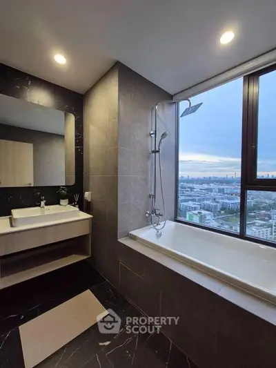 Luxurious bathroom with city view, featuring a modern bathtub and elegant fixtures.