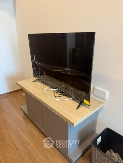 Modern living room with sleek TV on stylish wooden cabinet