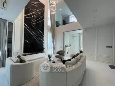Luxurious modern living room with high ceilings and elegant decor
