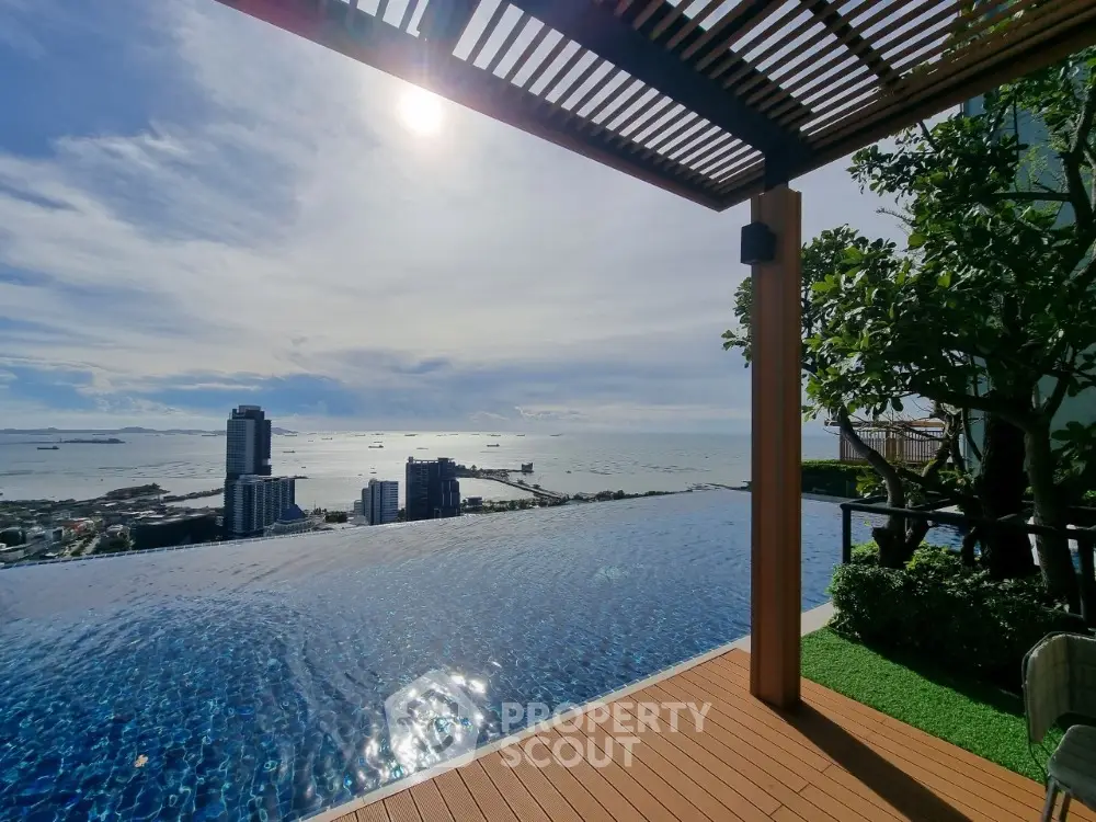 Stunning rooftop infinity pool with breathtaking ocean view and city skyline.