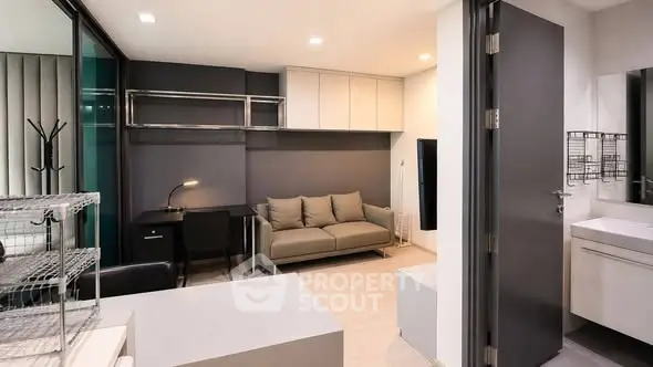 Modern studio apartment with sleek design and compact living space.