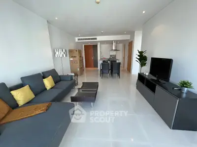 Spacious modern living room with sleek furniture and open layout, perfect for entertaining.