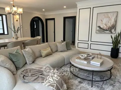 Luxurious living room with elegant decor and cozy sectional sofa in modern apartment.