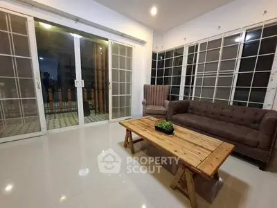 Spacious living room with elegant furniture and large windows for natural light