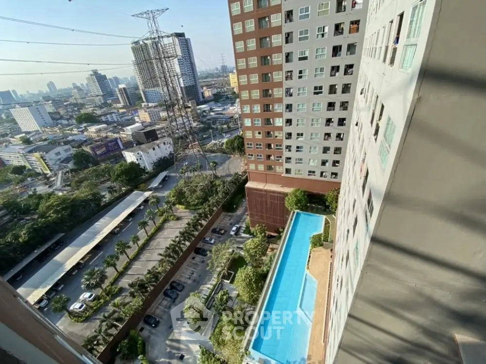 High-rise building with pool and city view from balcony