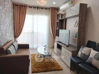 Stylish living room with modern decor, cozy sofa, and large TV unit, perfect for relaxation and entertainment.