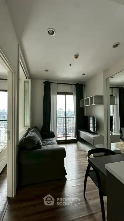 Modern living room with balcony view in urban apartment