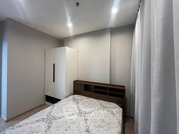 Cozy bedroom with modern design and ample natural light