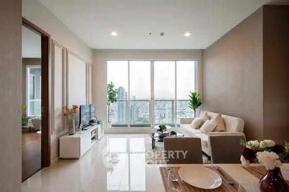 Modern living room with city view, elegant decor, and natural light.