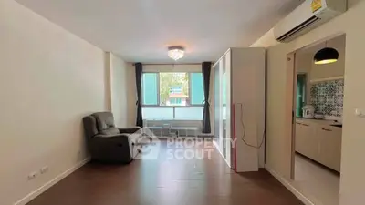 Spacious living room with modern kitchen in open layout apartment
