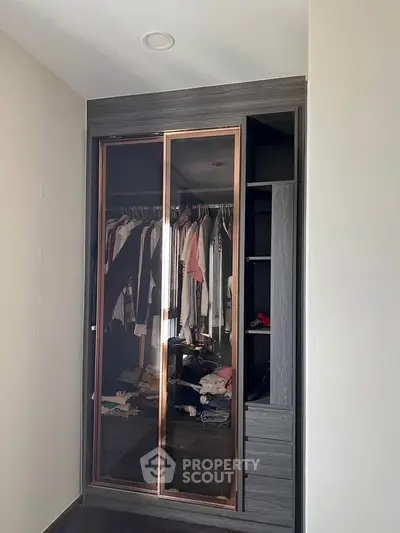 Modern bedroom wardrobe with sliding doors and ample storage space