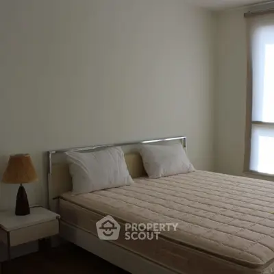 Cozy minimalist bedroom with natural light and modern decor