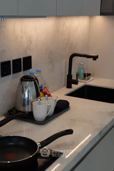 Modern kitchen with sleek countertop and stylish faucet