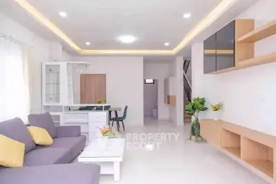 Modern living room with sleek furniture and bright lighting