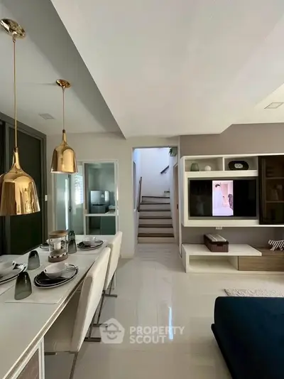 Modern living room with elegant dining area and stylish decor